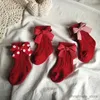 Calzini per bambini Calzini alti al ginocchio per neonate Calzini natalizi in cotone rosso con grande fiocco Scaldamuscoli in lana solida Calzini morbidi per bambini per bambini