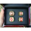 Klaster pierścieni 4pcs 1983 1994 1995 1997 Nebraska Cornhuskers National Championship Pierścień z drewnianymi pudełkiem pokazując