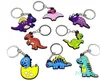 Nyckelringar 50st PVC Keychain Söt dinosaurie Keyring Wholesale Kids Anime Toys Anpassade nyckelkedja för biltillbehör Skolelärares gåva