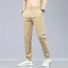 Calças masculinas Primavera Summer Cotton Men calças casuais cintura elástica negócios coreana moda corea clássica de cor sólida calça calça preta cáqui 230425