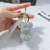 Fashion hot selling creative leopard print full diamond ball car keychain bow keychain ring personalized fashion women's handbag pendant wholesale