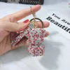 Moda venda quente criativo leopardo impressão cheia de diamantes bola carro chaveiro arco chaveiro anel personalizado moda feminina bolsa pingente atacado