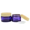 20G 30G 50G Clear Purple Glass Bottiglia riutilizzabile Vuoto Vasetti per crema per gli occhi Falso legno Coperchio a vite in plastica Imballaggio cosmetico Containe Qualità