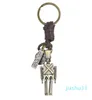 Nyckelringar handvävd retro cowhide nyckelring kreativ rörlig robotnyckel hänge