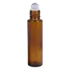 Rolka na olejek eterycznych z szklanką na butelkach z kulkami w rolce ze stali nierdzewnej i bambusową pokrywką uzupełniającą przezroczystą butelkę perfum