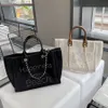 2022 Nieuwe kleine geurige canvas met lederen handketen Pearl Beach Mommy One Shoulder Tote Bag Groothandel handtassen 30 dollar