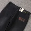 Jeans de marque salopette élastique pour hommes d'affaires jeans lavés style de broderie classique slim pantalon décontracté en tissu élastique haut de gamme résistant à l'usure