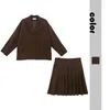 لباس من قطعتين بدلة يابانية للسيدات 2023 الخريف والشتاء تنورة مطوية طويلة الأكمام مجموعة من قطعتين