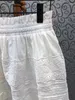 Юбки 2023 Женская мода Сексуальная повседневная полая вышитая короткая юбка универсальна 325