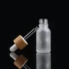 Mroźna przezroczysta szklana butelka z zakraplaczem z bambusową pokrywką Bambusa Opakowanie kosmetyczne okulary butelki olejku eterycznego Xaxmk