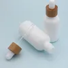 Opal White Glass Bottle 15ml 30ml 50ml with Bamboo Dropper 1OZ Wooden Essential Oil Bottles Porcelain Uoiak