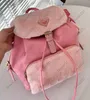 10A Diseñador de calidad Mochila de viaje Bolsos Mochila de nailon para mujer Estilo Mochila escolar Mochilas bolsa Deporte Paquetes al aire libre Carteras de bolso 27 cm con monedero