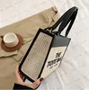 Bolsos de diseñador El bolso de mano Bolso de mujer de moda francesa Bolso de moda de PU tejido de paja Bolso de mano de alta calidad con un hombro cruzado