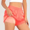 Calças curtas de ioga LLu para mulheres Roupas de ioga de cintura alta para corrida Shorts elásticos para exercícios Calças para adultos com zíper bolsos suspensos Roupas esportivas para meninas com cordão contínuo