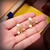 Orecchini elemento classico High-end galvanico squisito lettere d'oro spesse fiore decorazione geometrica orecchino gioielli di fascino femminile