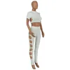 Pantalon deux pièces pour femmes KEXU blanc Sexy Slash Neck manches courtes haut court évider ensembles de trous Club Party femmes survêtements assortis