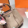 Borse casual da donna Borse firmate in pelle di alta qualità Borsa a tracolla con manico superiore alla moda Borsa a tracolla con pony e nastri 25 cm