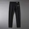 Men's Jeans designer 2023 Spring/Summer New High end Korean Edition Elastic Slim Fit Small Feet Black and White Three Defense Casual Pants C4UM