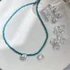 Kettingen elegante blauwe imitatie parel glazen bloem kralen ketting voor vrouw meisjes delicate sleutelbeen ketting geschenken ontwerp sieraden