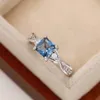 Обручальные кольца Huitan Нежные женские синие фианиты с поворотным дизайном Элегантное женское кольцо на палец для ювелирных изделий на юбилей 231124