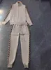 2 -częściowy zestaw dresowy Kobiet Designer Track Suit Kurt z miasteczkiem z długim rękawem z sznurkiem potowym spodni jesienią swobodne ścieżki