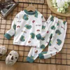 Pyjama's geprinte cartoon schattige baby lange mouw thuiskleding 2pcset peuter kostuum katoen comfort children ondergoed tops pant 231127