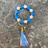 Boho personnalisé croix silicone perles cristal bracelet en cuir pu gland porte-clés