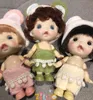 Dolls BJD for Girls 10cm OB11 Mini Doll 3D Blue Green Eyes Kawaii Pocket Toys Cute Surprise Face Clothes Toy Birthday Gift 230427