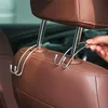 Novos 2 ganchos de aço inoxidável para o banco traseiro da linha de carro, decoração de assento, interior do carro, ganchos de encosto de cabeça ocultos, ganchos de armazenamento de bolsa