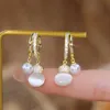 Stud Elegant and exquisite micro laid zircon egg white stone pearl pendant gold earrings suitable for women's unique design sweet and romantic jewelry gift 231128