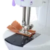 Maskiner Mini Sewing Machine Portable Handheld Stitch Sy Nickel Wordless Clothes Tyger Handelektriska symaskiner Tillbehör