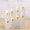 Flacone contagocce in vetro trasparente satinato Bottiglie di imballaggio cosmetico per profumo di olio essenziale con coperchio in legno imitato 20ml 30ml 50ml 60ml 100ml Guhcx