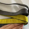 Industriële lange sleutelhanger gele nylon sling touw mode bagage hanger mannelijke en vrouwelijke gesneden legering gesp