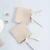 Pacote de jóias de microfibra de 50pcs para anéis de colar Brincos BROOCH JOWELLRY embalagem de camurça pequena de camurça de festas Bolsa de creme de creme de sacola com corda