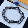 Bracelets de chaîne noire de luxe Cadeau de Noël pour petit ami Collier de bijoux de marque Charms de fleurs délicates Bracelet de chaîne de jeunesse Designer Mens Cubain Chaîne de titane pur