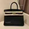 Designer di sacchetti Lychee Locke Classic Cowhide Bags H Togo H-Zip Grain Genuina in pelle Guida portatile Puscella Black versatile Lady Casual Luce Luce Erk1