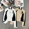 Kvinnors stickor Tees Designer Xiaoxiangfeng 2023 Ny imitation Mink Color Block Leather Logo Letter Stand Up Collar Dragkedja Långärmad kofta tröja för kvinnor K8UQ