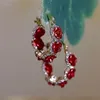 Stud New fashion trends unique design elegant and exquisite red rose zircon earrings suitable for womens jewelry wedding parties and high-end gifts 2024