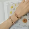 Bangle European Exquisite Classic Rose Gold Rope Knot Bracelet For Women High End Fashion Luxury Brand High Quality Jewelry Party Gifts 231129