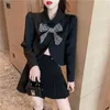 Robes de travail 2023 automne recadrée mode coréenne costumes femmes noires nœud à manches longues mince Sexy haut court Mini jupe deux pièces ensembles