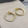 Örhängen gulddesigner smycken kvinna örhänge bijoux gratis mode frakt krok vriden tråd spänne örhängen i sterling sier med 14k