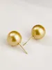 Boucles d'oreilles pendantes magnifiques énormes une paire de perles rondes dorées des mers du Sud de 11 à 12 mm, en or jaune 14 carats