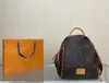 23SS Bolsa de asas de diseñador de lujo unisex Mochila explosiva Bolsa de viaje para mujer Bolsa de estudiante Mochila de lujo para exteriores Bolsa de maquillaje Monedero 31 cm