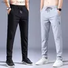 Mäns byxor Summer Men's Casual Pants Thin Soft Soft Elasticity Lace-up midja Solid Color Pocket Applique Korea Gray Black Work Byxor L231129