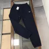 Män s byxor hög version p familj claic triangel standard sanitär pu unisex långa sport casual leggings