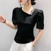 女性用Tシャツ2023夏のヨーロッパの服コットンTシャツファジョンセクシーなスキューカラーホローアウトレターレターズパフスリーブティー33050