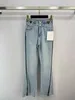 Kvinnors jeans designer denim mikro blossade ben split byxor 23 sommar ny hög midja bantning ljusblå kvinnors ins byxor p6iv