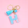 Keychains Fashion Blue Tassel A-Z Letters Initiële hars sleutelhangers ringen handtas hanger schattige auto sleutelen charme tas accessoireskeychains