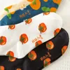 Mulheres meias kawaii dos desenhos animados bonito laranja caqui desejos padrão comprimento médio feminino algodão lazer estilo esportivo para casal