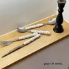 Set di stoviglie Europa Moda Set di posate di perle in acciaio inossidabile Creatività regalo Forchetta Manico da tavola Coltello in ceramica Posate Spo M0R7